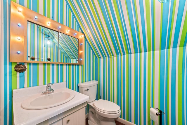 220 E Main St, Gaylord, MI 49735 - bathroom featuring vanity and wallpapered walls