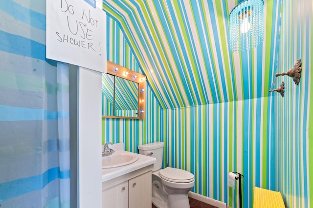 220 E Main St, Gaylord, MI 49735 - bathroom featuring wallpapered walls and vanity
