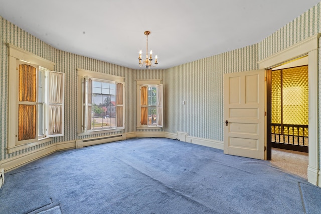 220 E Main St, Gaylord, MI 49735 - spare room featuring wallpapered walls, carpet flooring, and a chandelier