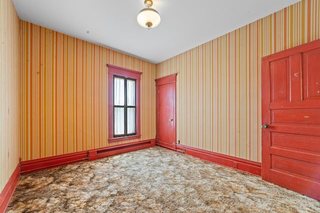 220 E Main St, Gaylord, MI 49735 - carpeted empty room with wallpapered walls