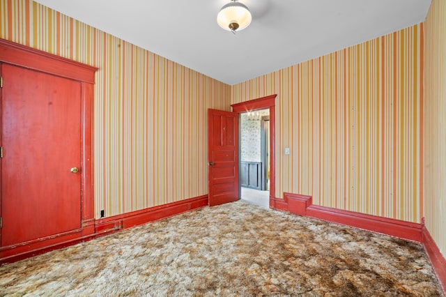 220 E Main St, Gaylord, MI 49735 - unfurnished room featuring carpet and wallpapered walls