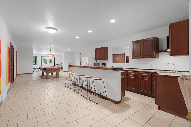 142 Frisco Dr, Houghton Lake, MI 48629 - kitchen featuring a kitchen breakfast bar, billiards table, freestanding refrigerator, and recessed lighting