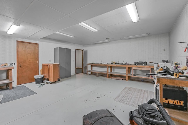 142 Frisco Dr, Houghton Lake, MI 48629 - miscellaneous room featuring a workshop area and concrete floors