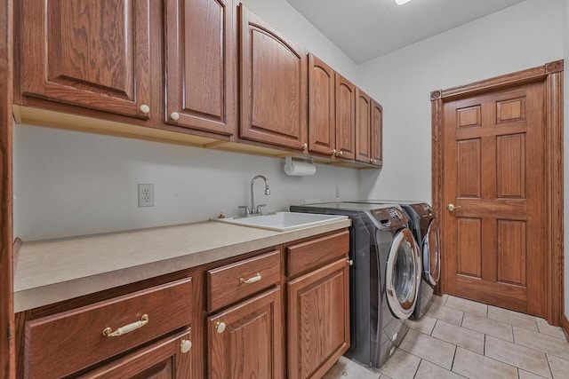 142 Frisco Dr, Houghton Lake, MI 48629 - laundry area with cabinet space, washing machine and dryer, and light tile patterned floors