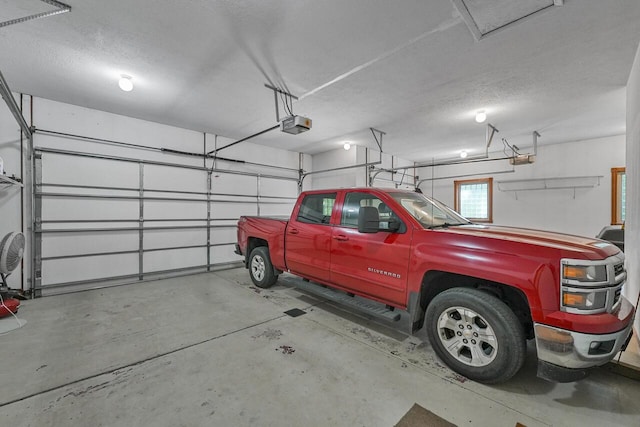 142 Frisco Dr, Houghton Lake, MI 48629 - garage featuring a garage door opener