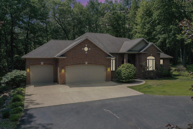 142 Frisco Dr, Houghton Lake, MI 48629 - view of front of home featuring driveway, a garage, brick siding, and a front lawn
