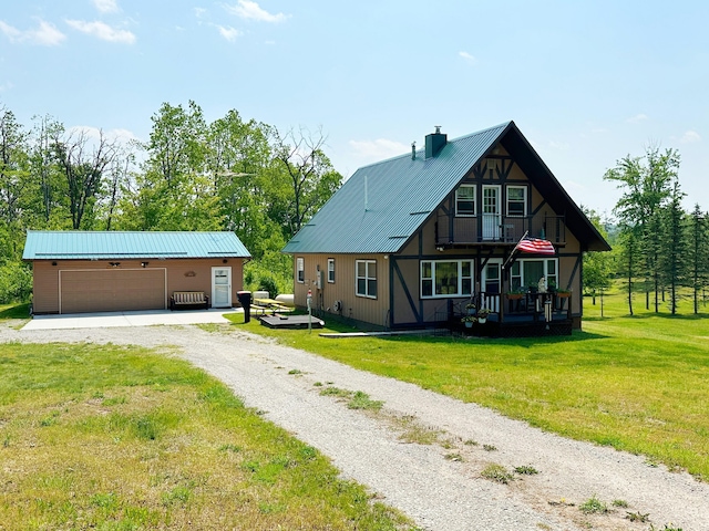 2585 M-33, Comins, MI 48619 - view of front of house with gravel driveway, a front yard, an outdoor structure, and a metal roof