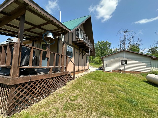 2585 M-33, Comins, MI 48619 - view of property exterior featuring a lawn
