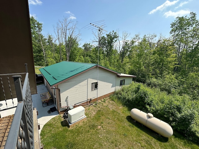 2585 M-33, Comins, MI 48619 - view of property exterior with a lawn