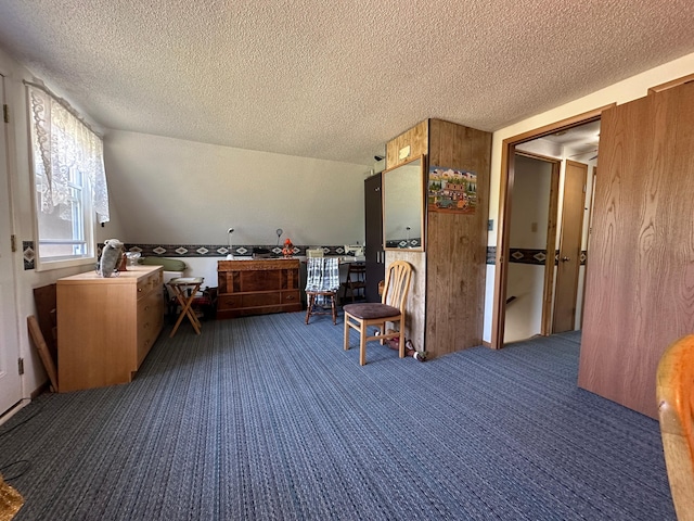 2585 M-33, Comins, MI 48619 - sitting room with carpet floors and a textured ceiling