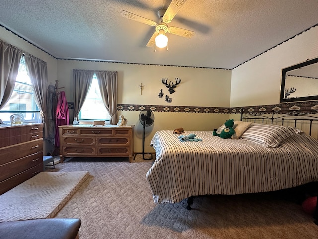 2585 M-33, Comins, MI 48619 - carpeted bedroom with a textured ceiling and a ceiling fan