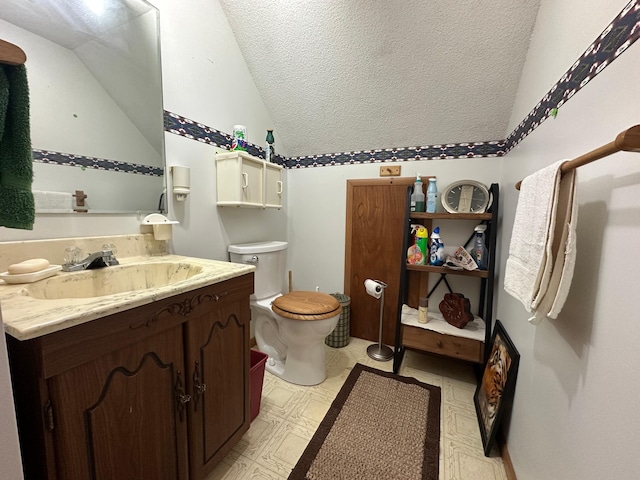 2585 M-33, Comins, MI 48619 - bathroom with lofted ceiling, vanity, tile patterned floors, and a textured ceiling