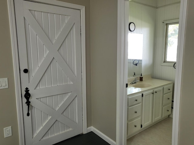 1251 Kingston Ave, Flint, MI 48507 - bathroom featuring vanity and baseboards