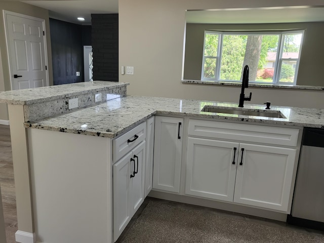 1251 Kingston Ave, Flint, MI 48507 - kitchen featuring stainless steel dishwasher, white cabinetry, light stone countertops, and recessed lighting