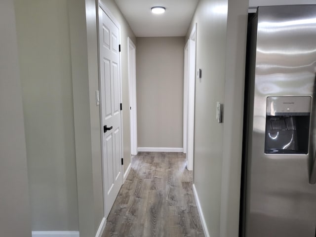 1251 Kingston Ave, Flint, MI 48507 - hallway featuring wood finished floors and baseboards