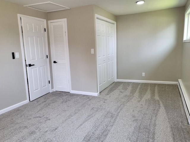 1251 Kingston Ave, Flint, MI 48507 - unfurnished bedroom with carpet floors, a baseboard heating unit, and attic access