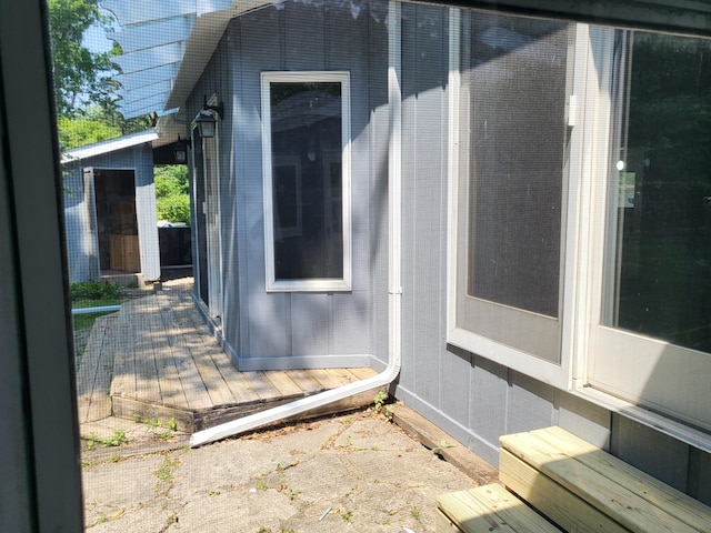1251 Kingston Ave, Flint, MI 48507 - doorway to property featuring a wooden deck