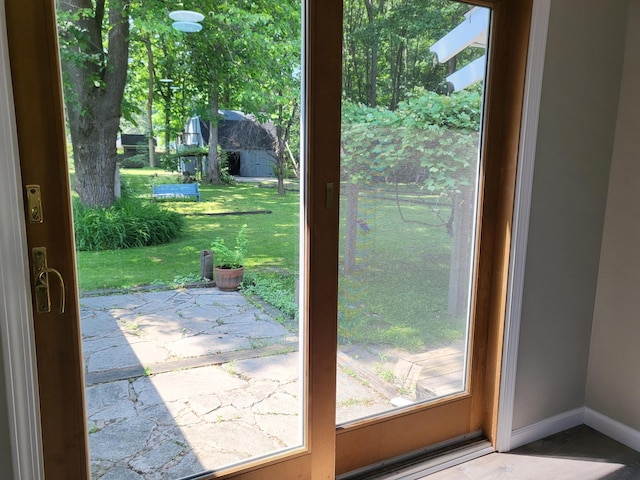 1251 Kingston Ave, Flint, MI 48507 - doorway to outside with baseboards