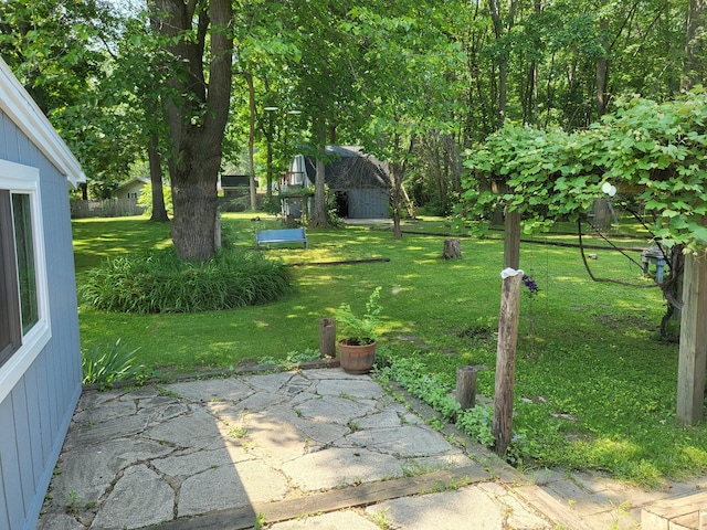 1251 Kingston Ave, Flint, MI 48507 - view of green lawn featuring a patio