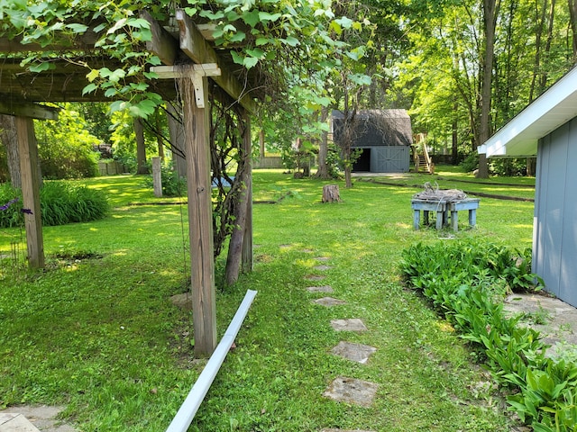 1251 Kingston Ave, Flint, MI 48507 - view of yard with a storage unit