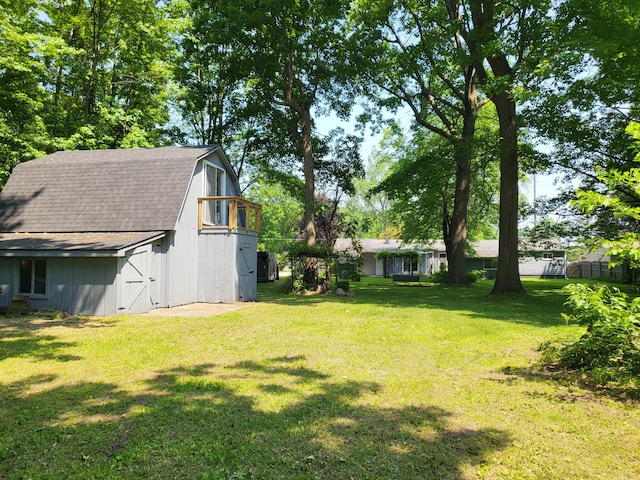 1251 Kingston Ave, Flint, MI 48507 - view of grassy yard featuring a barn and an outdoor structure