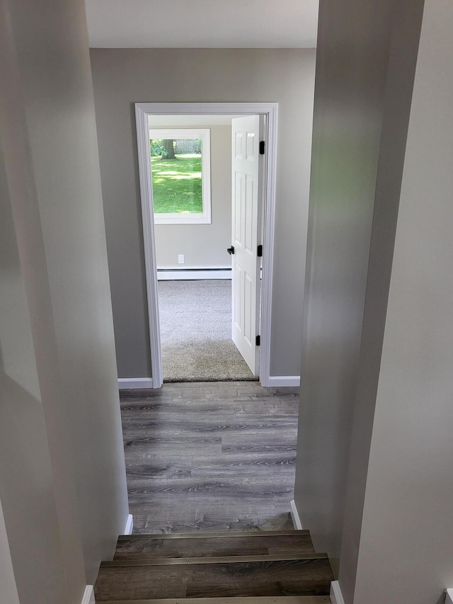 1251 Kingston Ave, Flint, MI 48507 - hall with a baseboard radiator and wood finished floors