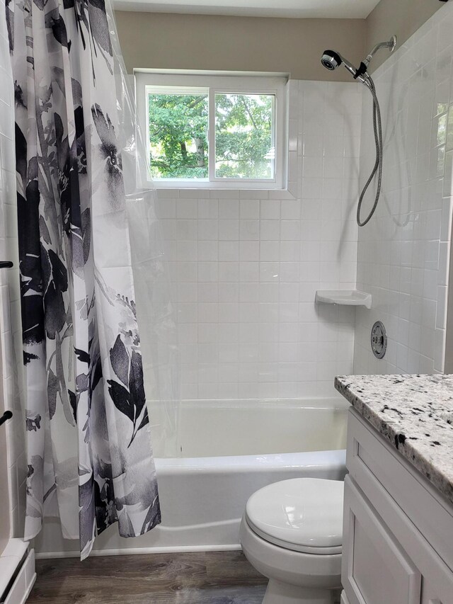 1251 Kingston Ave, Flint, MI 48507 - bathroom with vanity, wood finished floors, and shower / tub combo