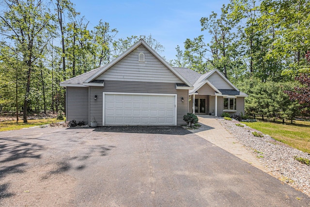6296 Wolverine Trl, Gaylord, MI 49735 - view of front of home featuring driveway and a garage