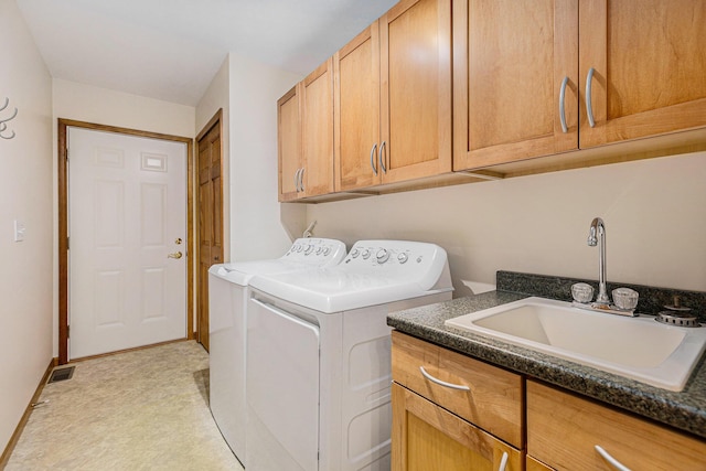 6296 Wolverine Trl, Gaylord, MI 49735 - laundry room featuring washer and clothes dryer and cabinet space