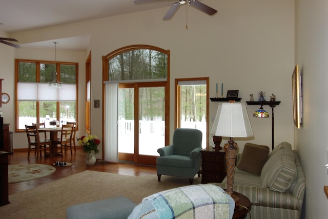 6296 Wolverine Trl, Gaylord, MI 49735 - living room featuring a ceiling fan, wood finished floors, and a towering ceiling