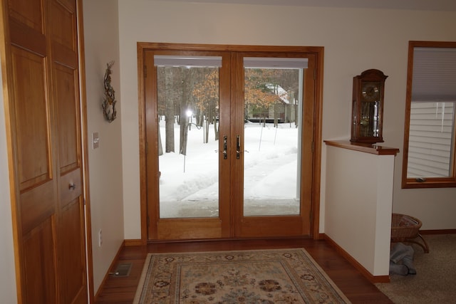 6296 Wolverine Trl, Gaylord, MI 49735 - doorway with french doors and wood finished floors
