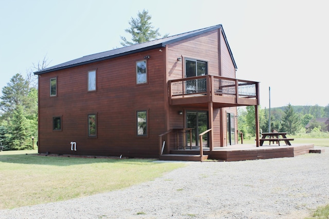 3009 NE Trl, Grayling, MI 49738 - view of property exterior with a deck and a lawn