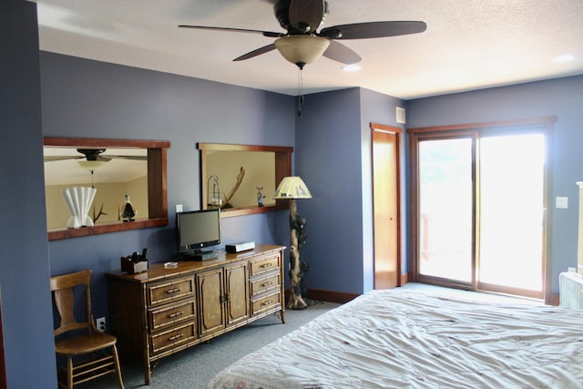 3009 NE Trl, Grayling, MI 49738 - carpeted bedroom with baseboards and a ceiling fan