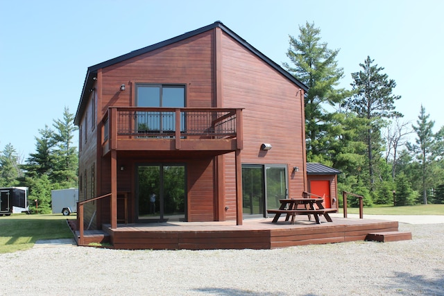 3009 NE Trl, Grayling, MI 49738 - back of house with a balcony and a wooden deck