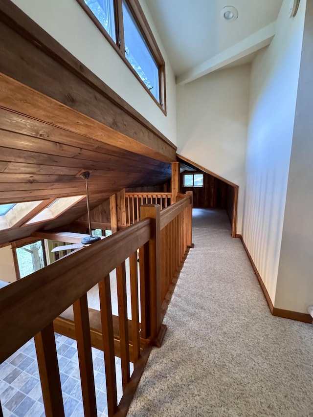 5200 Pine Grove Dr, Spruce, MI 48762 - hallway featuring an upstairs landing, lofted ceiling, and carpet floors