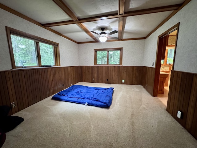 5200 Pine Grove Dr, Spruce, MI 48762 - carpeted spare room with wainscoting, wooden walls, coffered ceiling, ceiling fan, and beam ceiling