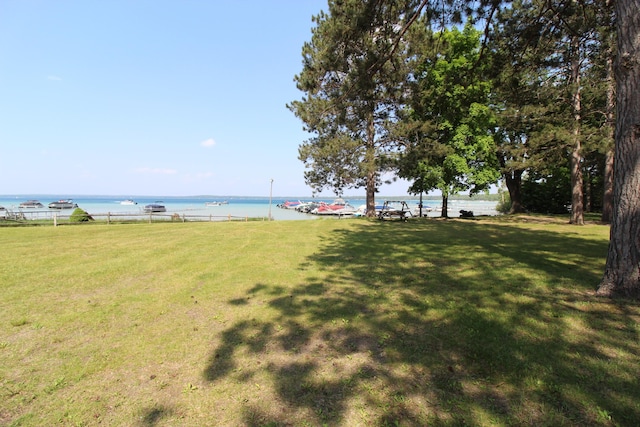 211 Daytona Rd, Roscommon, MI 48653 - view of green lawn featuring a water view