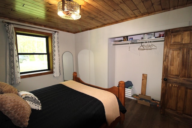 211 Daytona Rd, Roscommon, MI 48653 - bedroom with wood ceiling and dark wood-style flooring