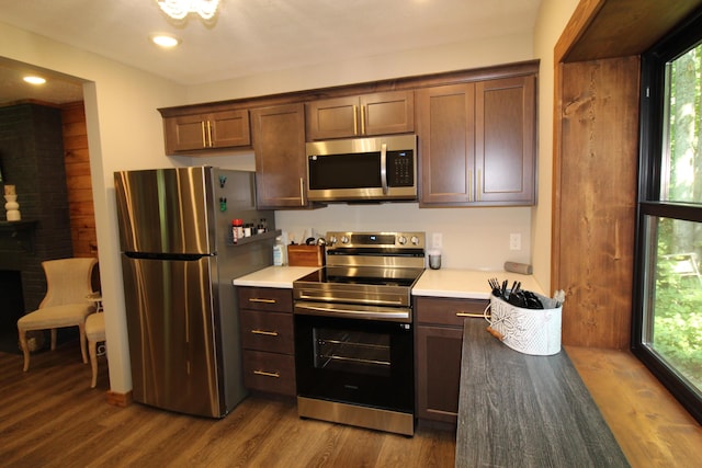 211 Daytona Rd, Roscommon, MI 48653 - kitchen with appliances with stainless steel finishes, healthy amount of natural light, wood finished floors, light countertops, and recessed lighting