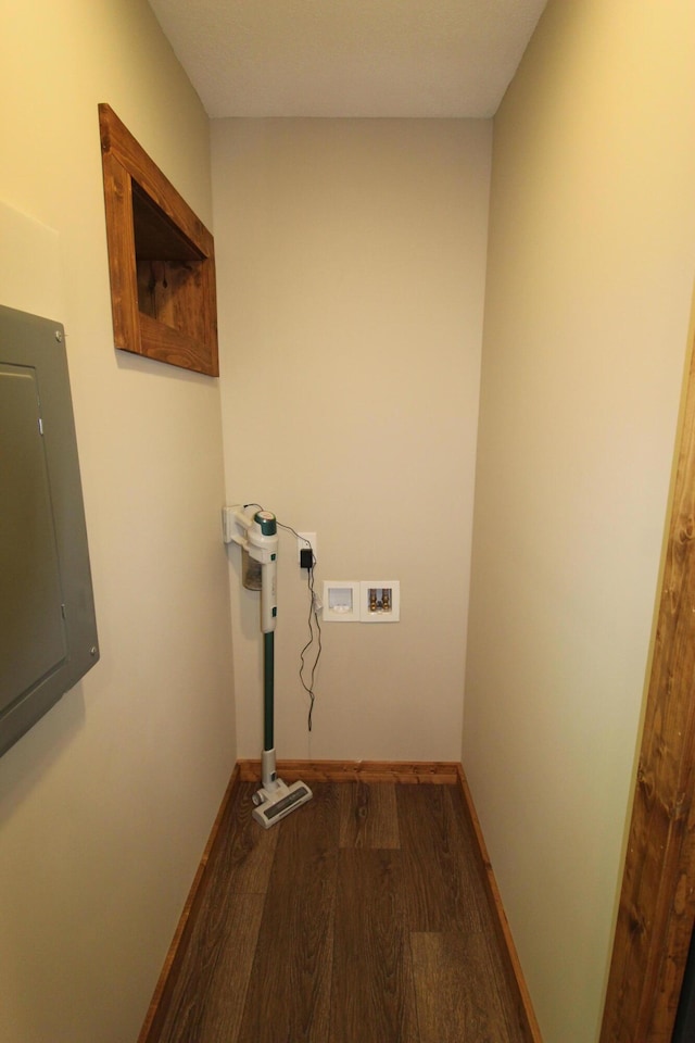 211 Daytona Rd, Roscommon, MI 48653 - laundry room featuring electric panel, wood finished floors, and hookup for a washing machine