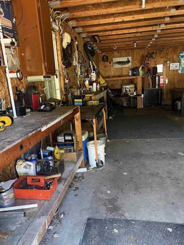 577 Wilderness Trl, Saint Helen, MI 48656 - miscellaneous room with a workshop area and concrete flooring