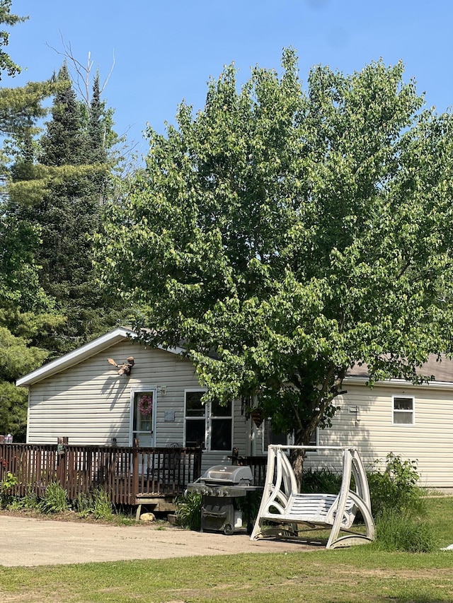 577 Wilderness Trl, Saint Helen, MI 48656 - rear view of property featuring a deck