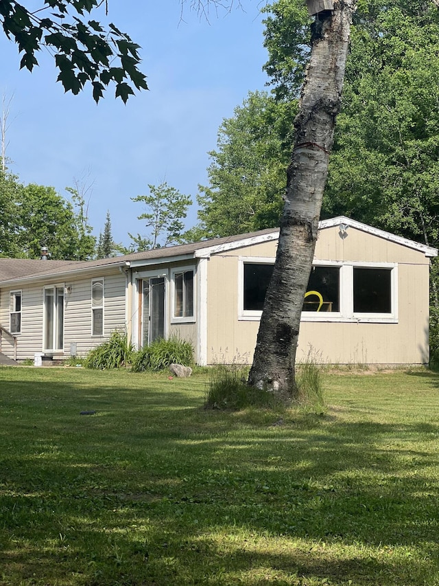 577 Wilderness Trl, Saint Helen, MI 48656 - view of front of home with a front yard