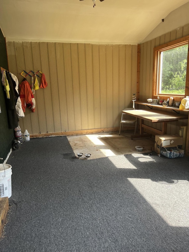 577 Wilderness Trl, Saint Helen, MI 48656 - misc room with lofted ceiling, carpet flooring, and wooden walls