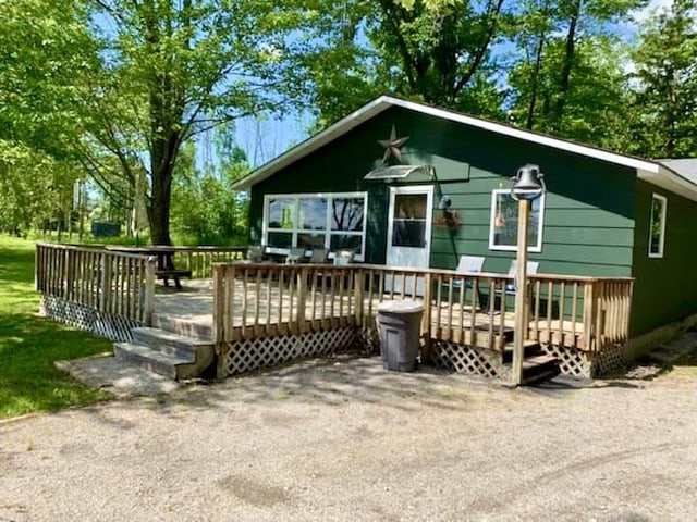 14781 Shubert Hwy, Posen, MI 49776 - view of front facade with a wooden deck