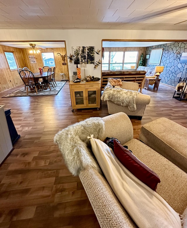 14781 Shubert Hwy, Posen, MI 49776 - living area with healthy amount of natural light, wood finished floors, and wooden walls