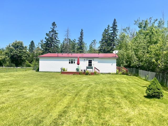 1604 Harrison Ave, Cheboygan, MI 49721 - rear view of house with a deck and a metal roof