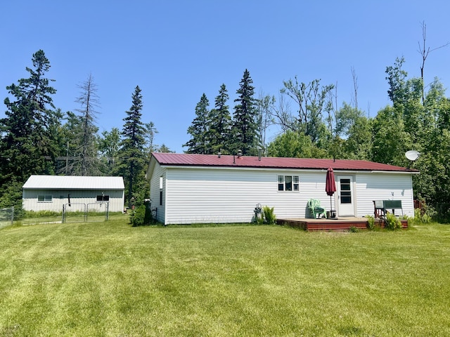 1604 Harrison Ave, Cheboygan, MI 49721 - back of house with a wooden deck and a metal roof