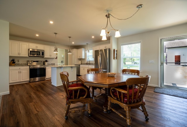 1817 Lindburgh Ln, Cheboygan, MI 49721 - dining space featuring dark wood-style floors, recessed lighting, and a chandelier