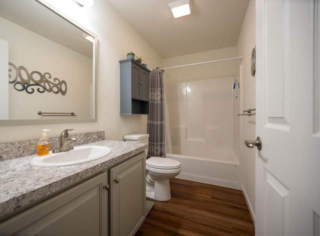 1817 Lindburgh Ln, Cheboygan, MI 49721 - full bathroom with vanity, shower / bath combination with curtain, and wood finished floors
